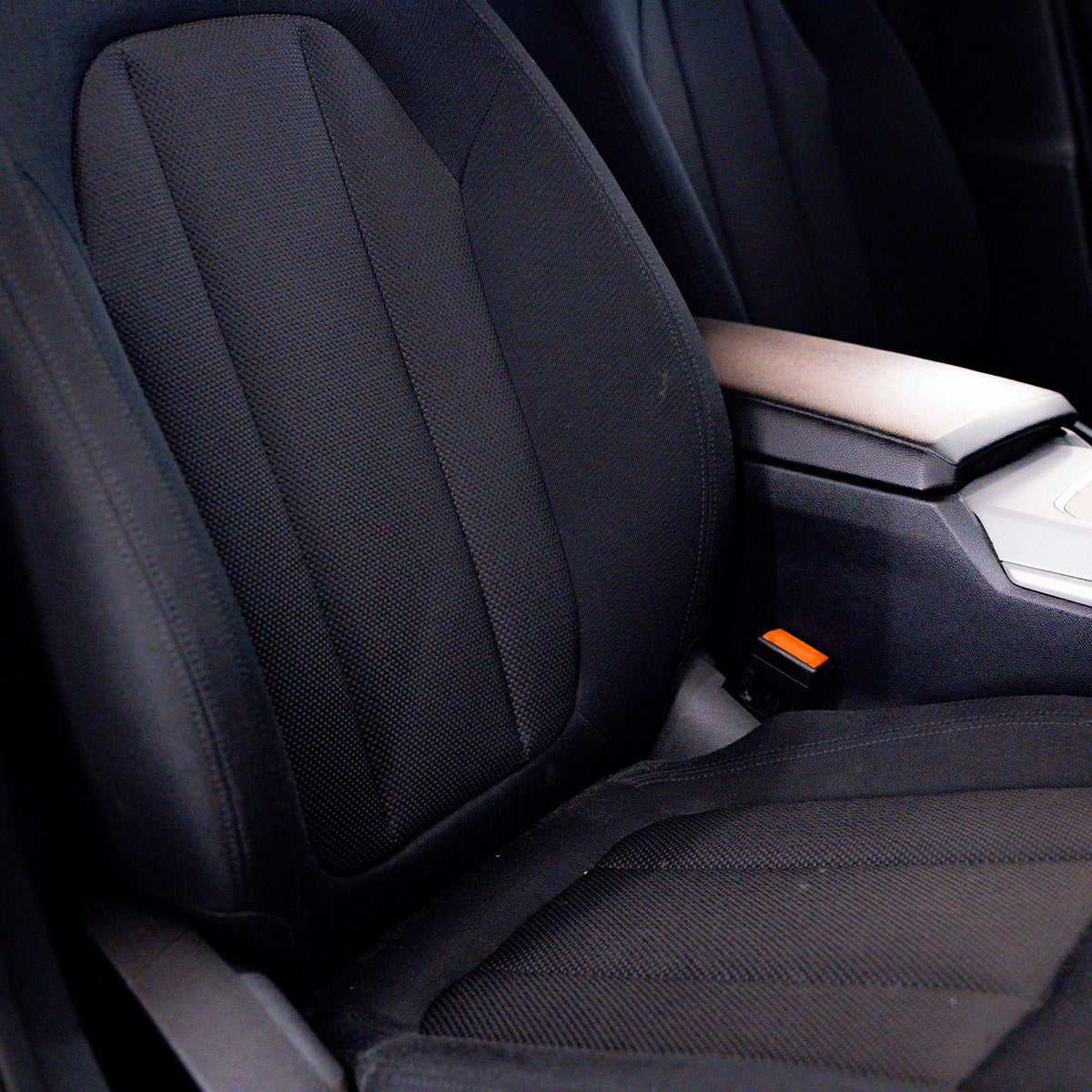 Close-up of a car seat with a focus on the backrest and side panel.