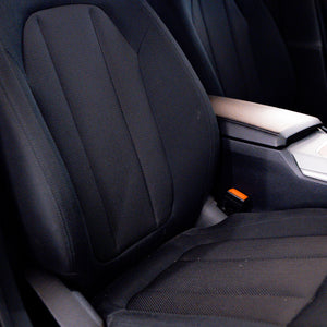 Close-up of a car seat with a focus on the backrest and side panel.