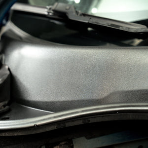 Close-up of a car's hood with a textured surface