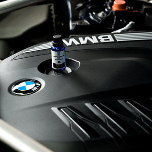 Bottle of Labocosmetica TPR on a BMW engine cover