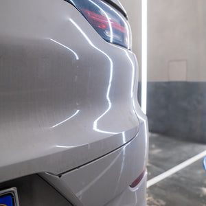 Close-up of a car's rear end with a blurred background