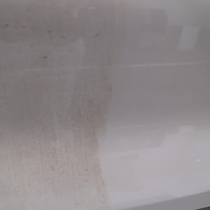 Close-up of a white surface with a visible stain