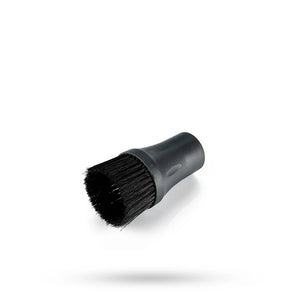 Black cleaning brush on a white background