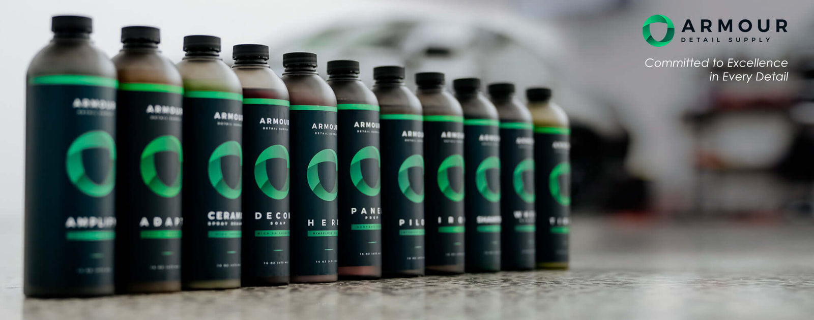 Armour Detail Supply high-performance detailing chemicals displayed in studio setting