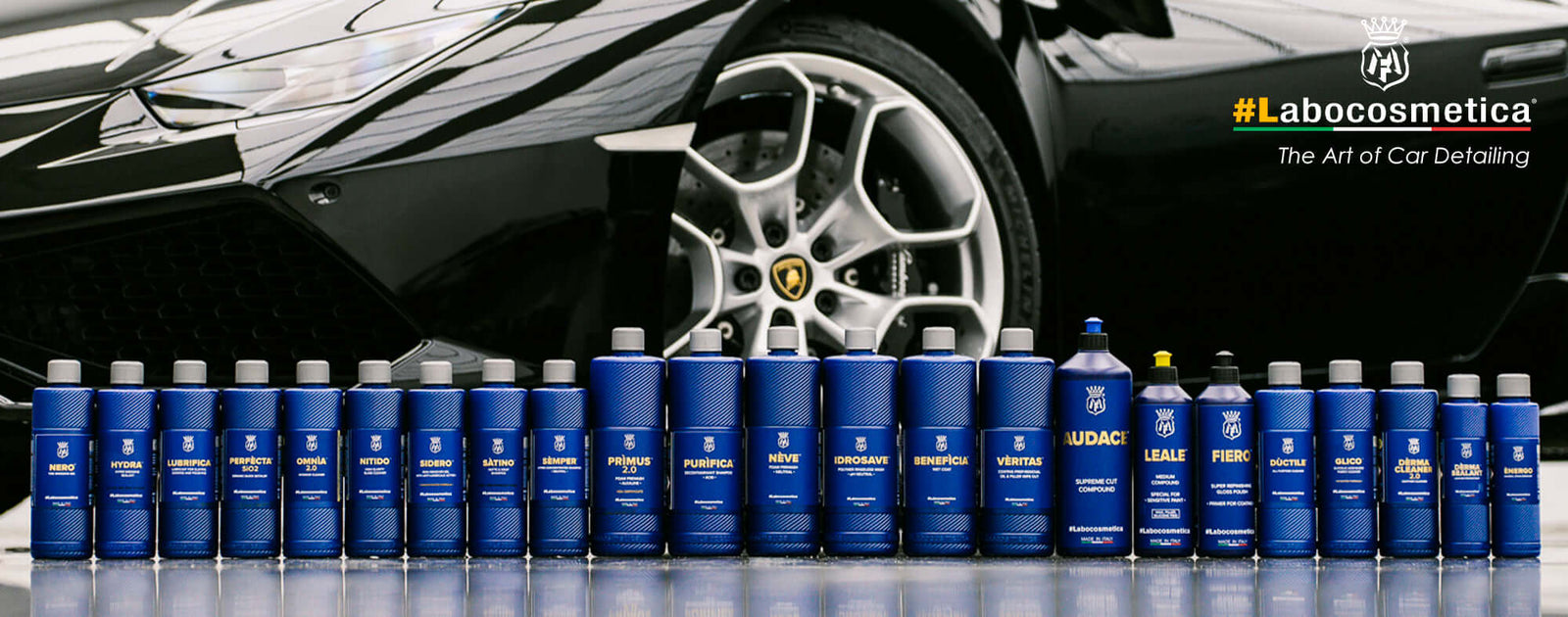 Labocosmetica car care products displayed in detailing studio with black Lamborghini Huracán