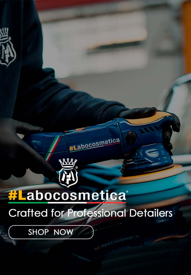 Labocosmetica car care products displayed in detailing studio with black Lamborghini Huracán