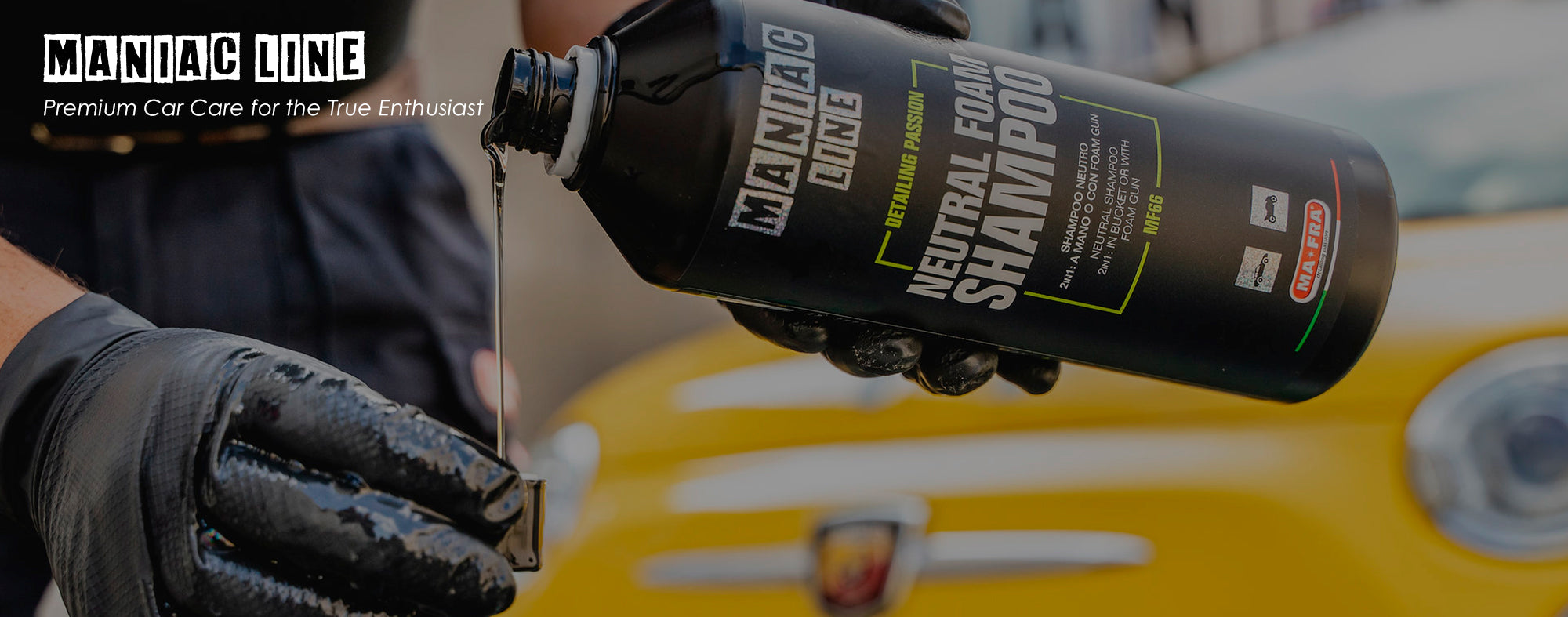 Maniac Line foam shampoo for car detailing displayed with yellow Fiat